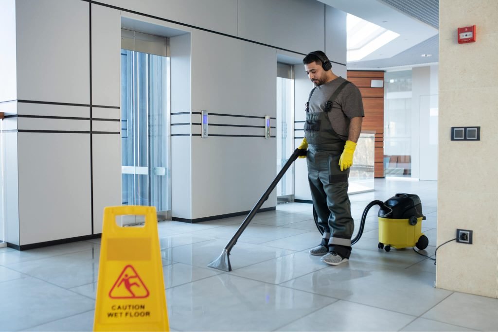 full-shot-man-vacuuming-floor 1